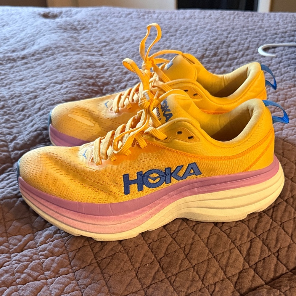 Hoka Yellow Running Shoes with Pink Midsole and Blue Logo